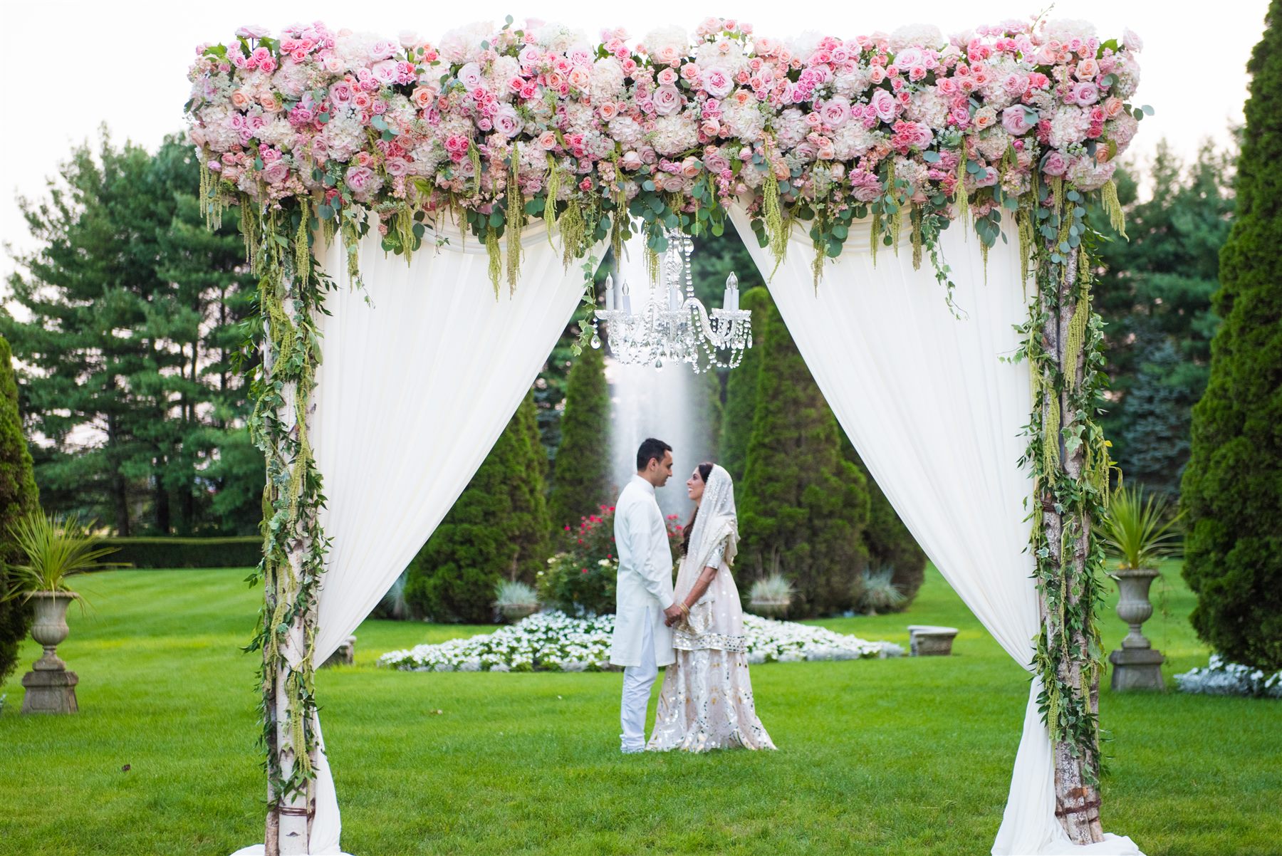 The mandap in blush and white on the great lawn