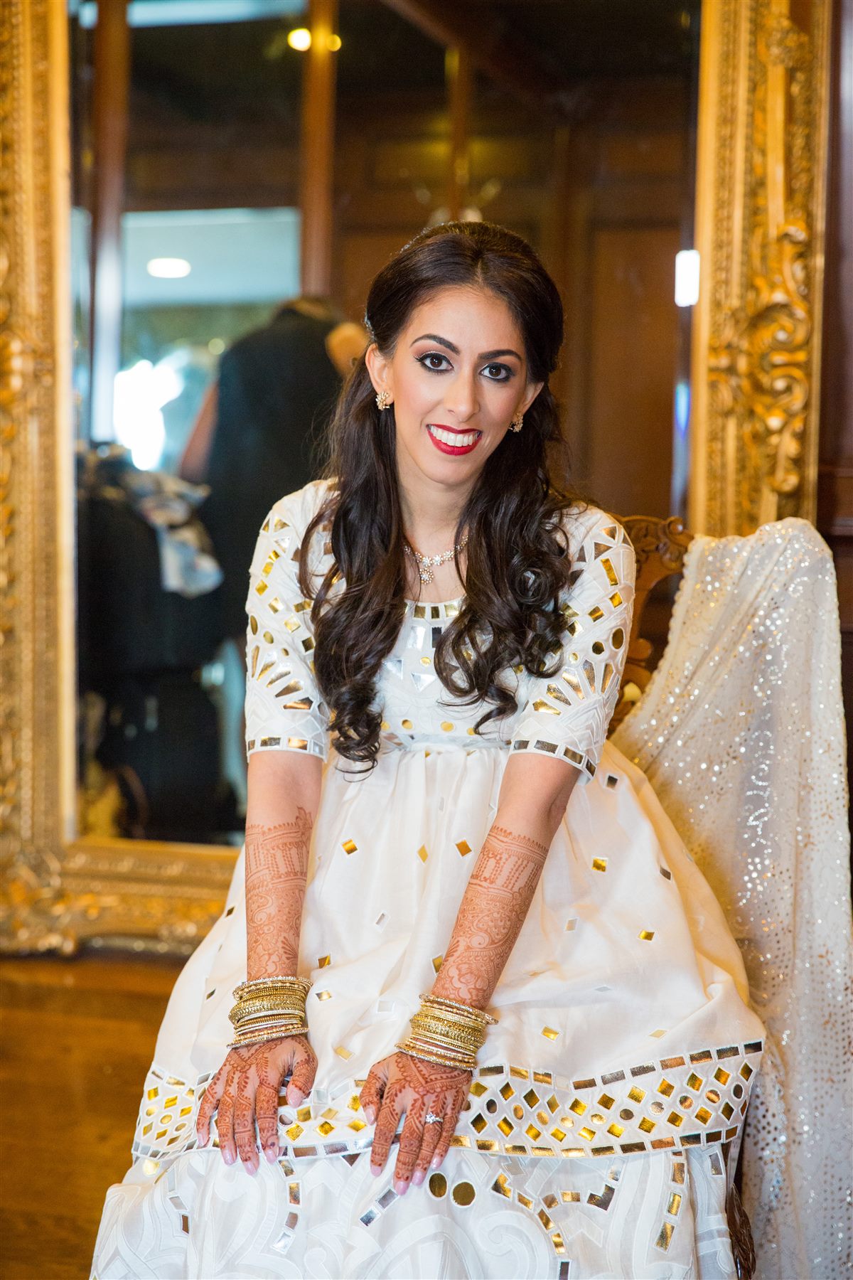 The bride at the gilded mirror