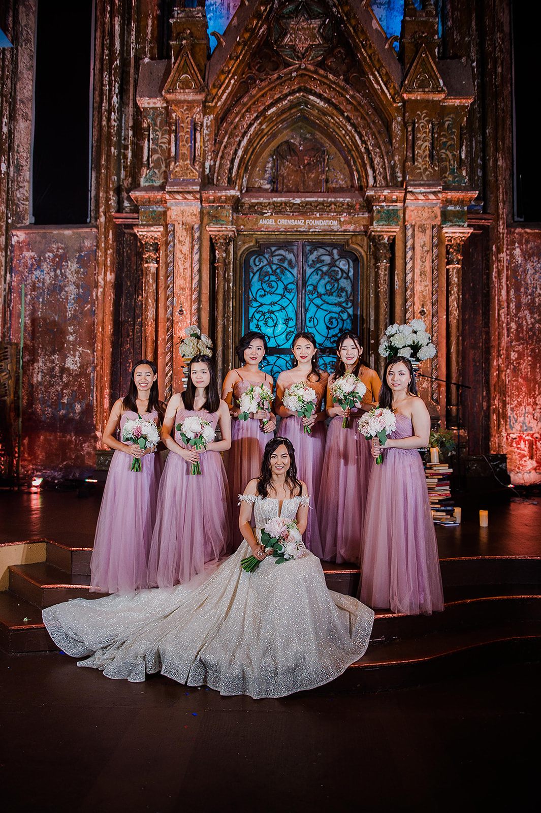 The bride, the bridesmaids in blush and lavender