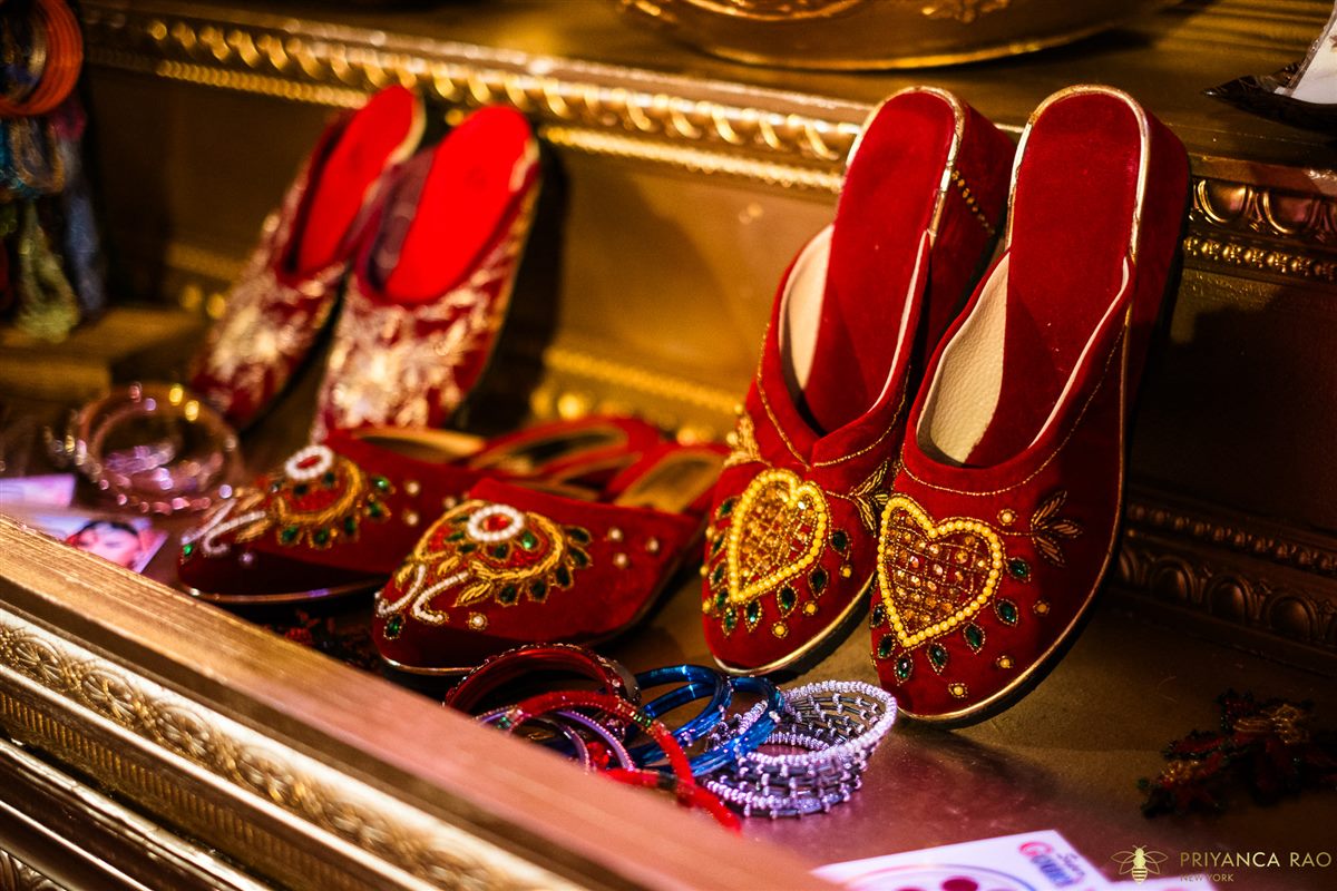 Embroidered juttis on the mantel