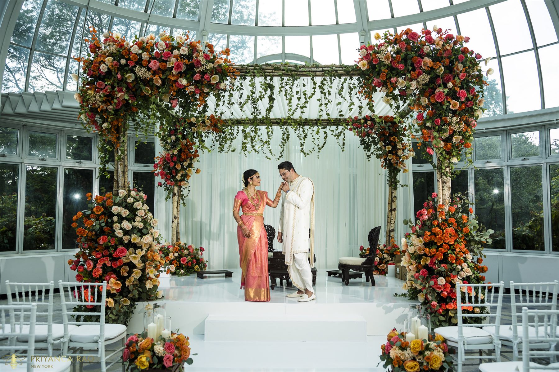 Vows beneath the rose mandap