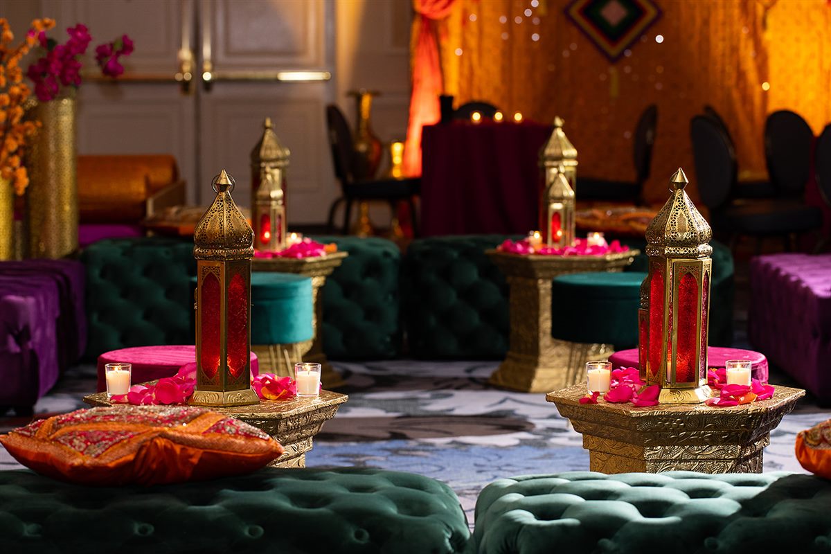 The sangeet lounge, lanterns on gold pedestals