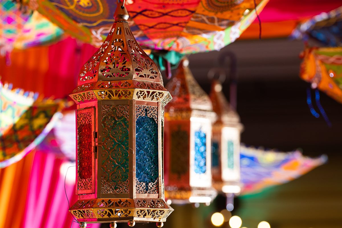 A pierced brass lantern, lit
