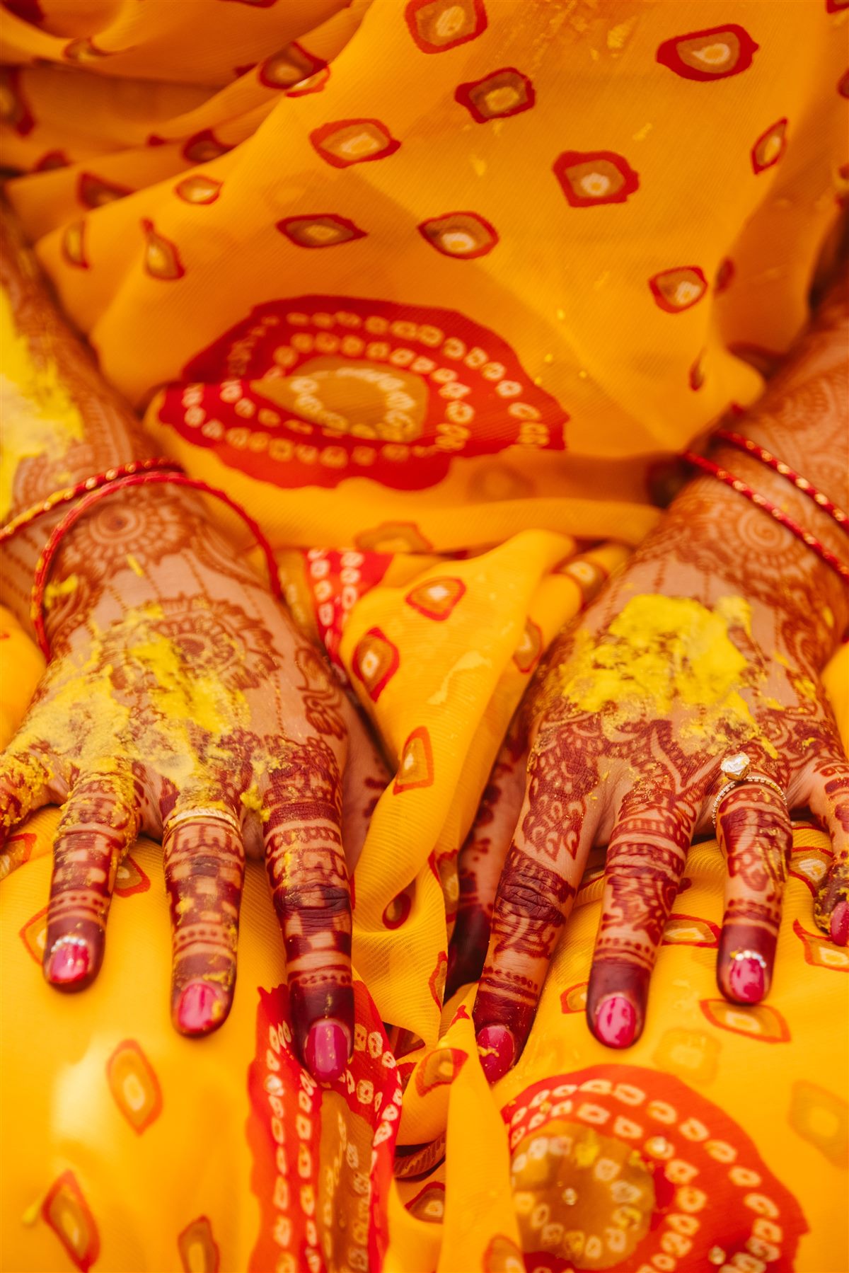 Mehndi and turmeric on the bride's hands