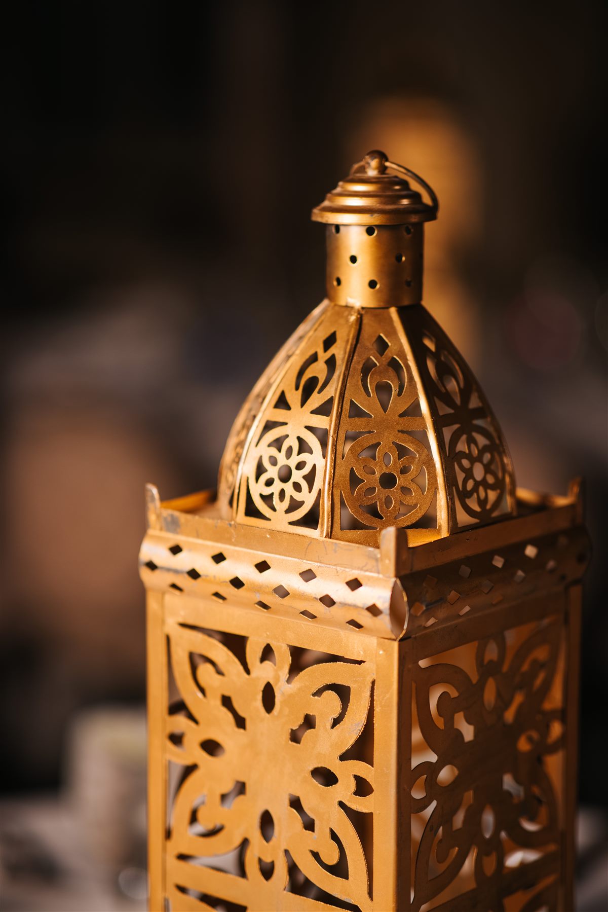 Pierced gold lanterns on the tables