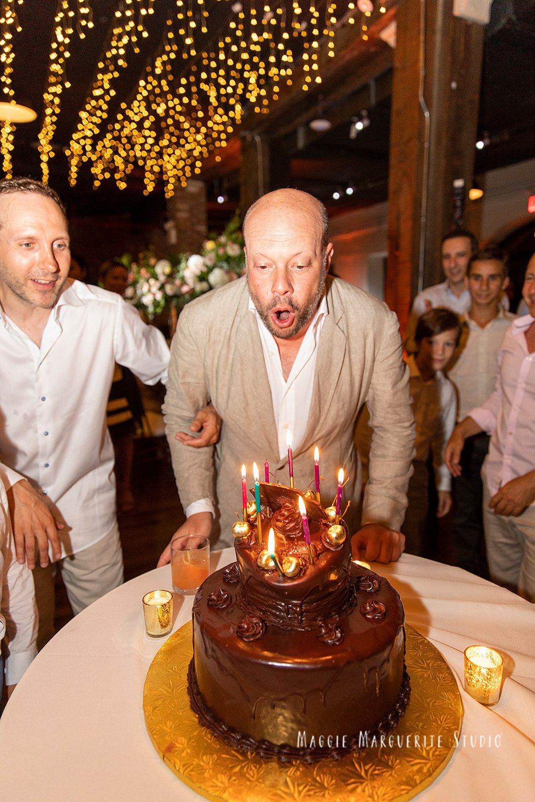 Chocolate cake, candles lit