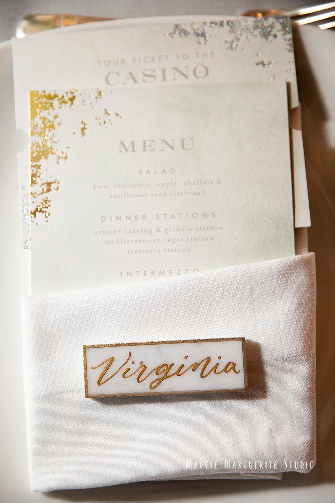 A place set in gold script